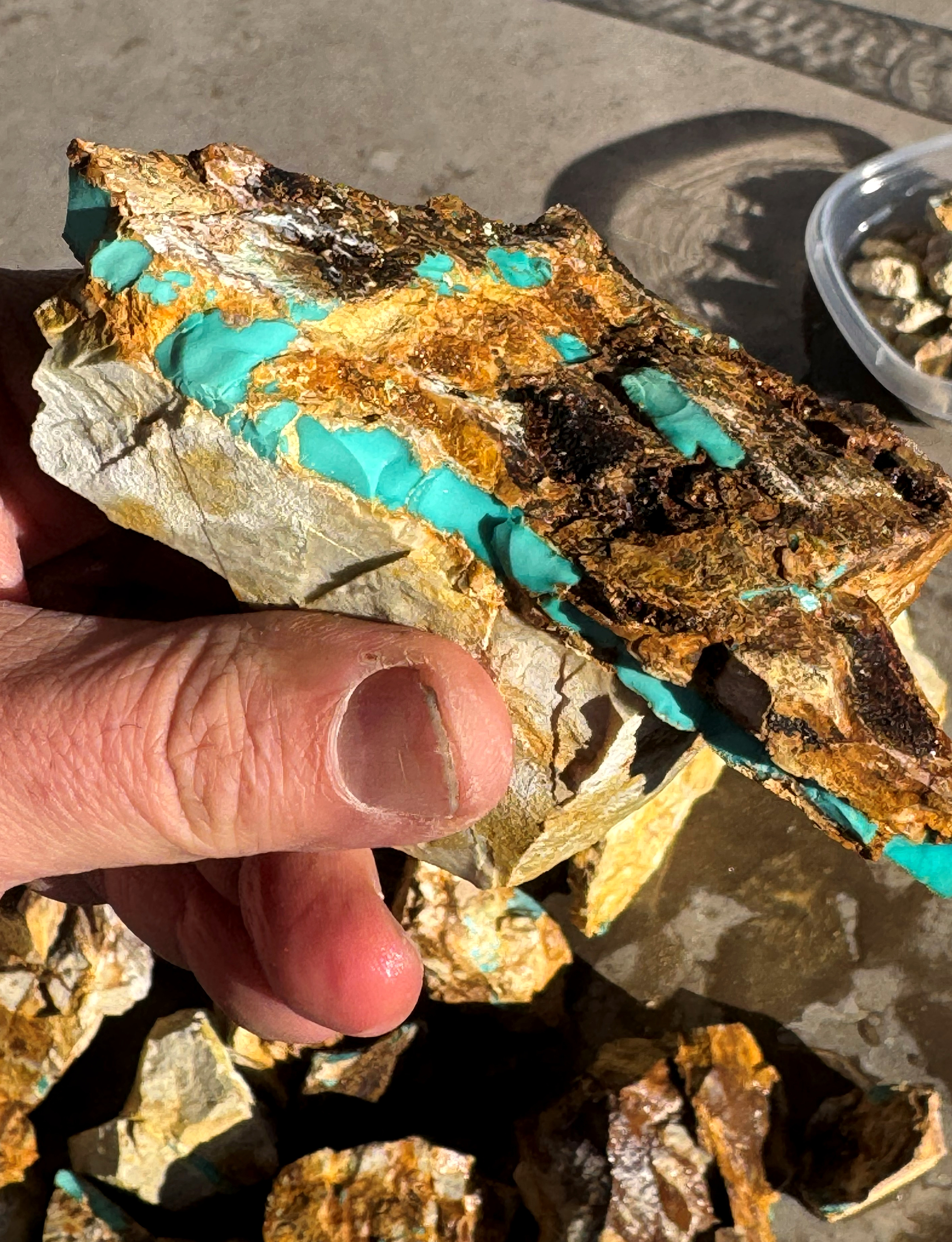 Close view of turquoise running through its natural host rock