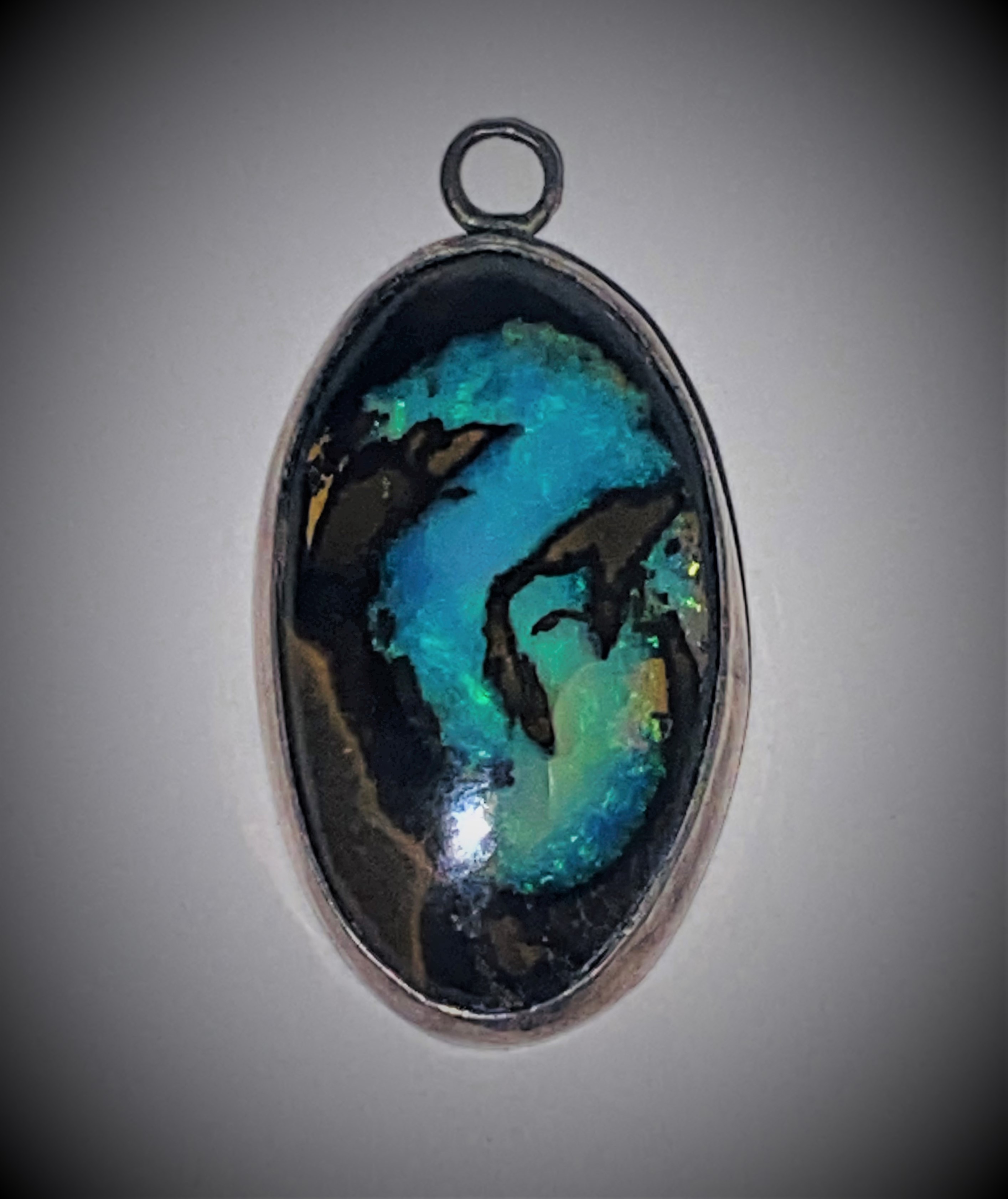 The Blue Dragon boulder opal in a simple finished pendant